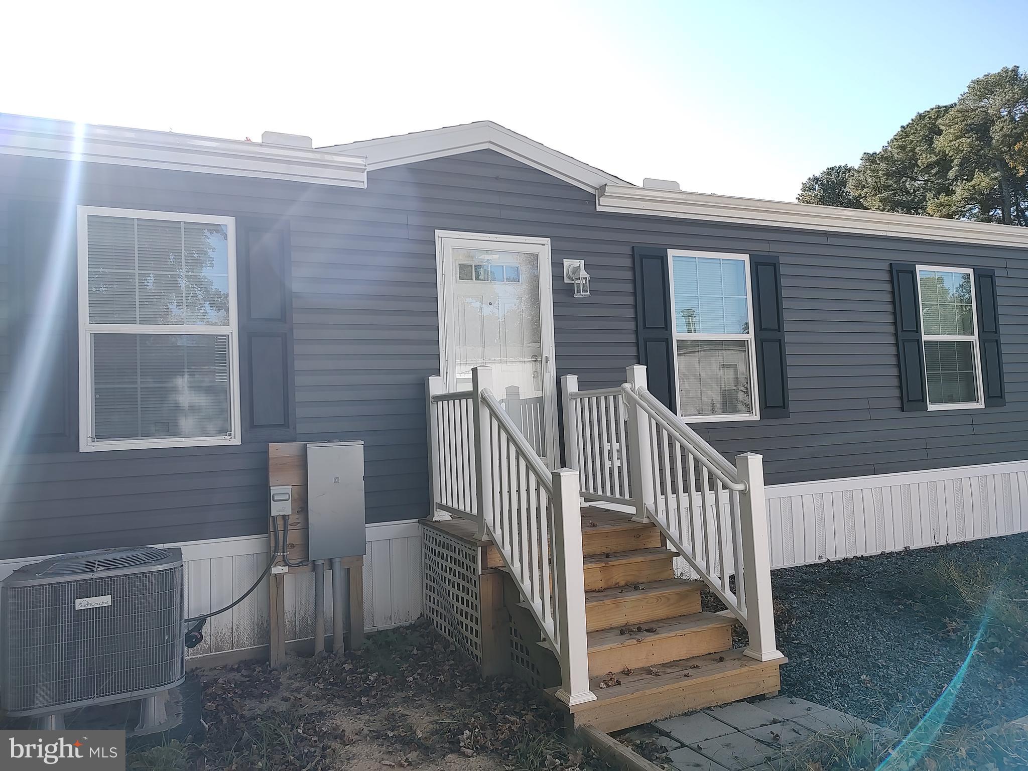 12623 Shell Mill Road, Unit 51 Bishopville, MD 21813 - Photo 10 of 41 a view of a house with backyard and porch