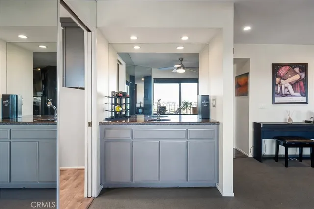 a view of a livingroom with furniture and a kitchen