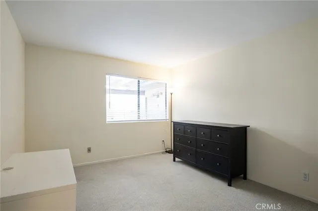 an outdoor living space with furniture and a flat screen tv