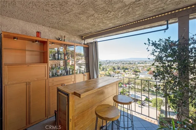 a bedroom with a bed and painting on the wall