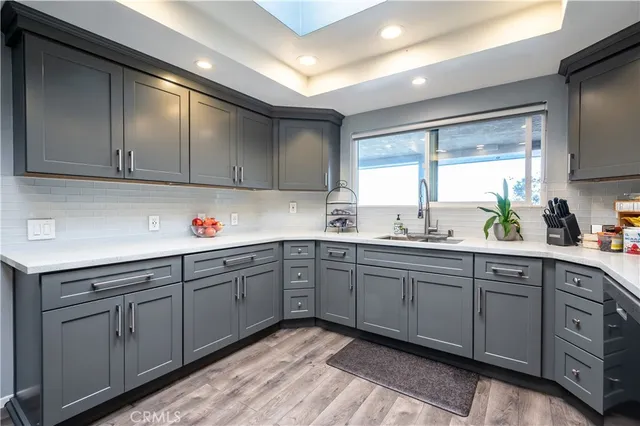 a kitchen with sink cabinets and window