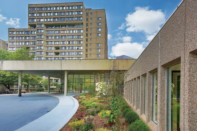 a front view of a building with garden