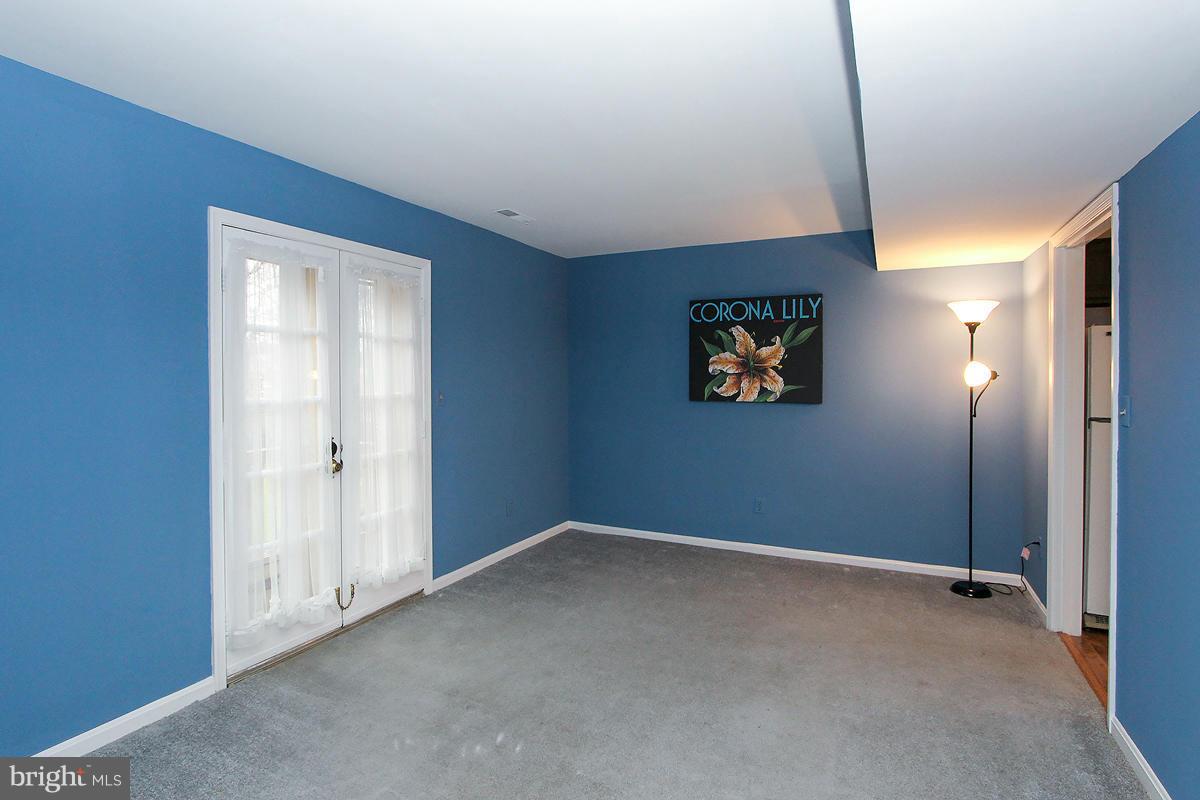6720 Hillandale Road, Unit 15 Chevy Chase, MD 20815 - Photo 13 of 26 Living Room with French Doors to Deck!