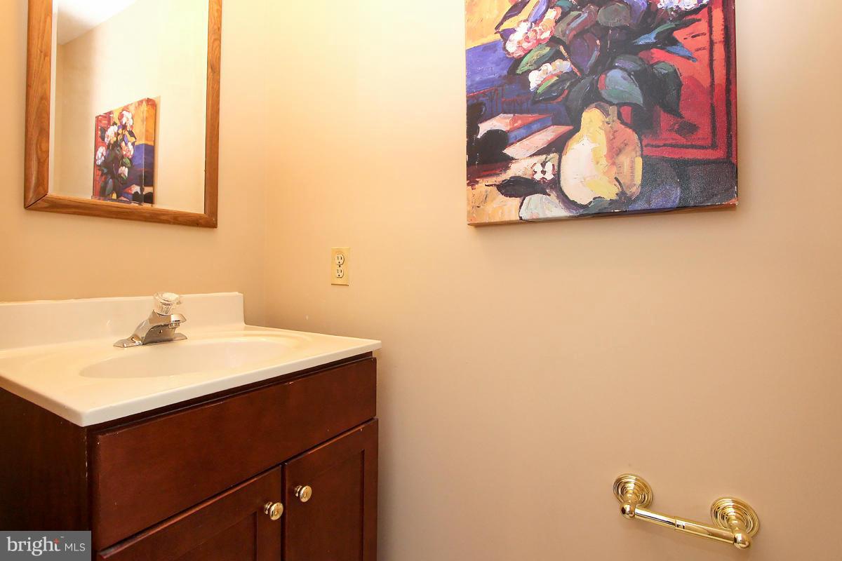 6720 Hillandale Road, Unit 15 Chevy Chase, MD 20815 - Photo 14 of 26 Powder Room on main level