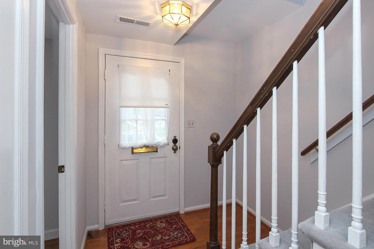 6720 Hillandale Road, Unit 15 Chevy Chase, MD 20815 - Photo 3 of 26 Foyer w/coat closet