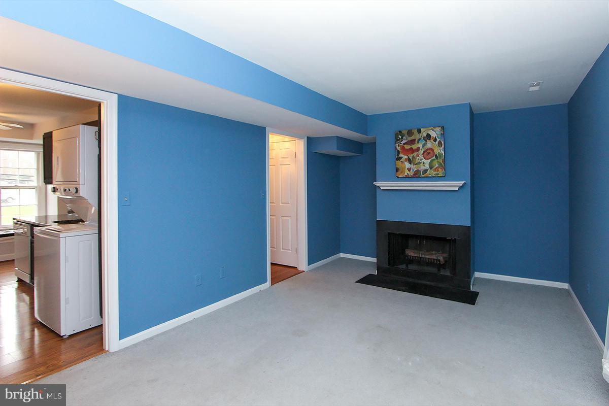 6720 Hillandale Road, Unit 15 Chevy Chase, MD 20815 - Photo 10 of 26 Living Room with fireplace