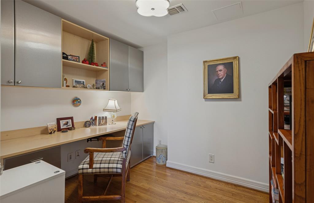 3401 Lee Parkway, Unit 2106 Dallas, TX 75219 - Photo 11 of 34 a workspace with furniture and wooden floor