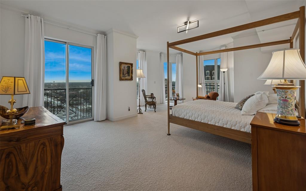 3401 Lee Parkway, Unit 2106 Dallas, TX 75219 - Photo 12 of 34 a spacious bedroom with a bed and large windows