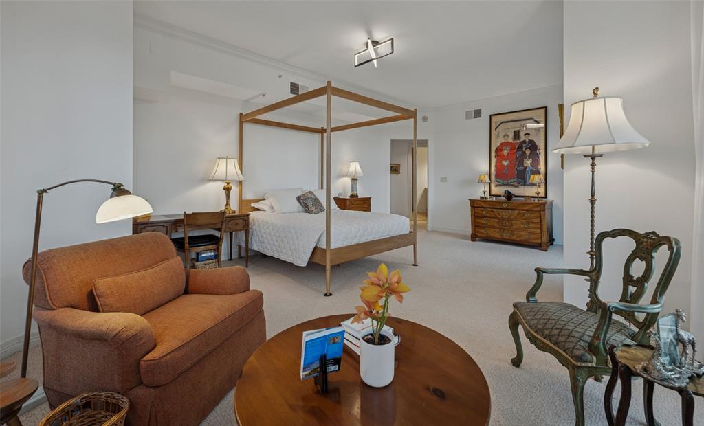 3401 Lee Parkway, Unit 2106 Dallas, TX 75219 - Photo 13 of 34 a bedroom with furniture and a couch