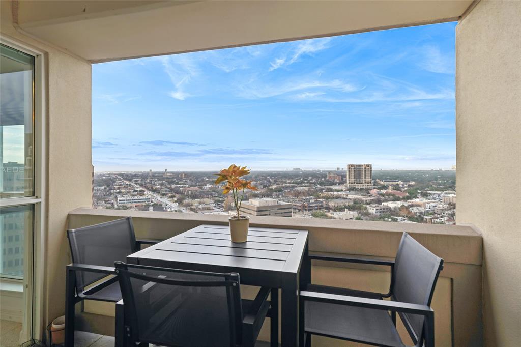 3401 Lee Parkway, Unit 2106 Dallas, TX 75219 - Photo 23 of 34 a view of a city from a dining room with furniture