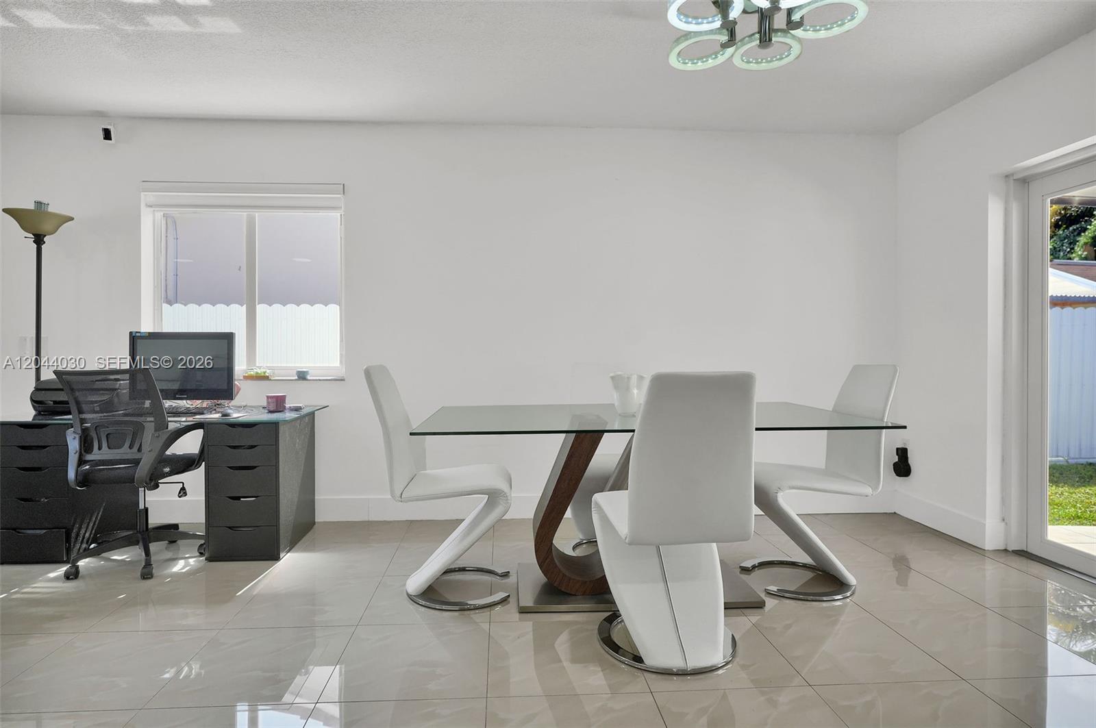12551 Southwest 223rd Street Miami, FL 33170 - Photo 5 of 35 a view of a workspace with furniture