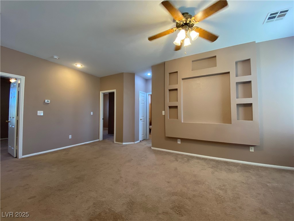 5680 Arrow Tree Street Las Vegas, NV 89130 - Photo 12 of 27 Unfurnished bedroom featuring carpet floors and a ceiling fan