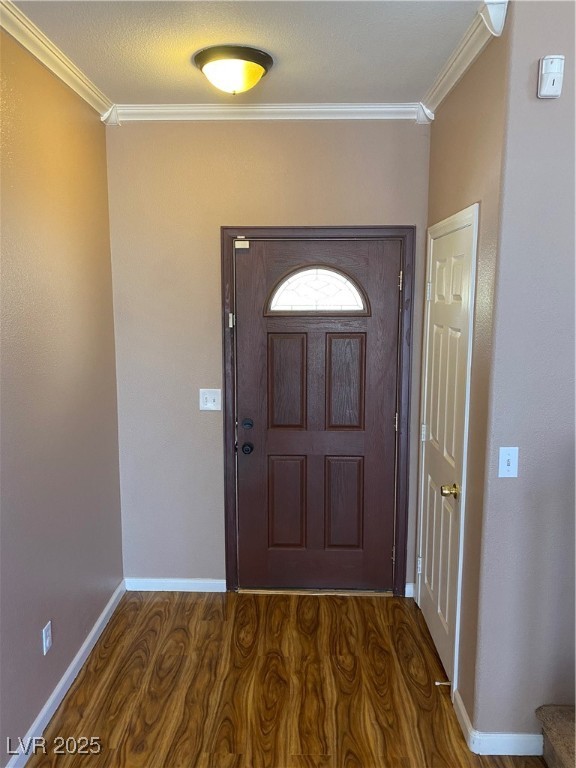 5680 Arrow Tree Street Las Vegas, NV 89130 - Photo 3 of 27 Entryway with crown molding and wood finished floors