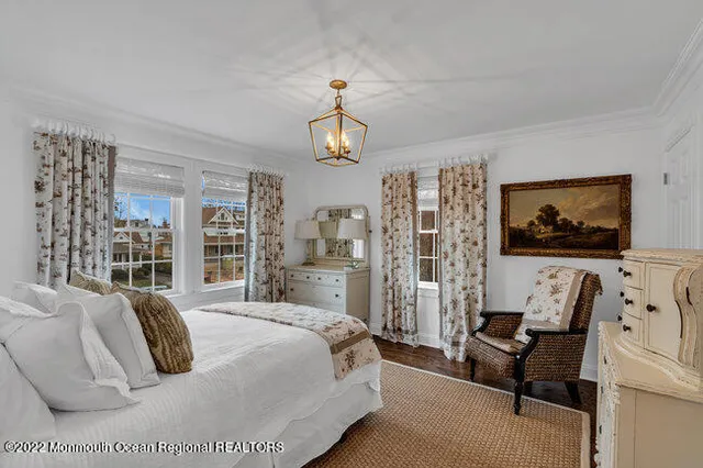 a bedroom with a bed couch and window