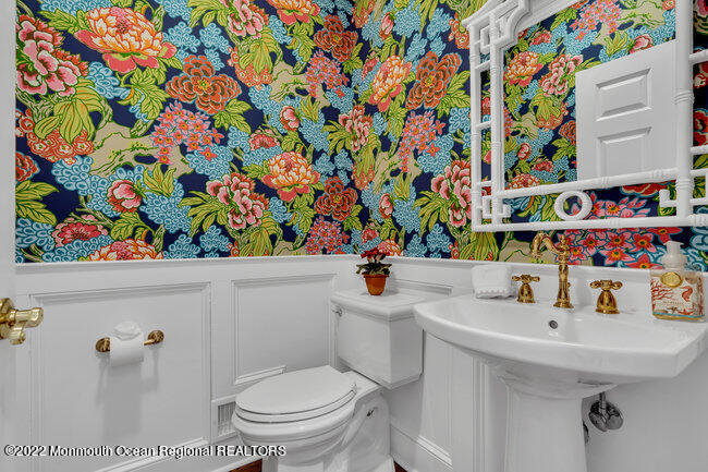 312 Essex Avenue Spring Lake, NJ 07762 - Photo 8 of 29 a bathroom with a sink toilet and a shower curtain