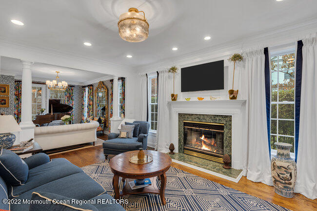 312 Essex Avenue Spring Lake, NJ 07762 - Photo 9 of 29 a living room with furniture a flat screen tv and a fireplace