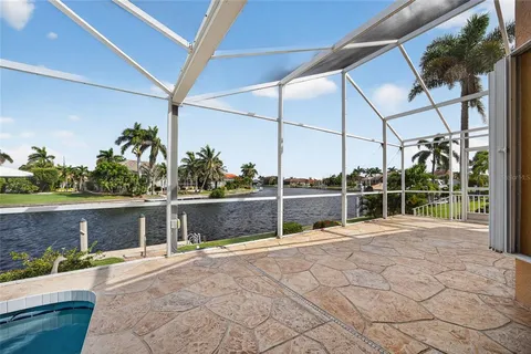 a view of a house with a backyard and a tub