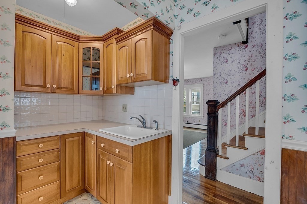 15 Halmstad Street Worcester, MA 01607 - Photo 12 of 25 a bathroom with a sink a mirror and shower