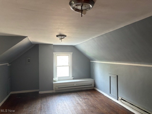 3258 Berkshire Road Cleveland, OH 44118 - Photo 18 of 23 Additional living space with a baseboard heating unit, wood finished floors, and vaulted ceiling