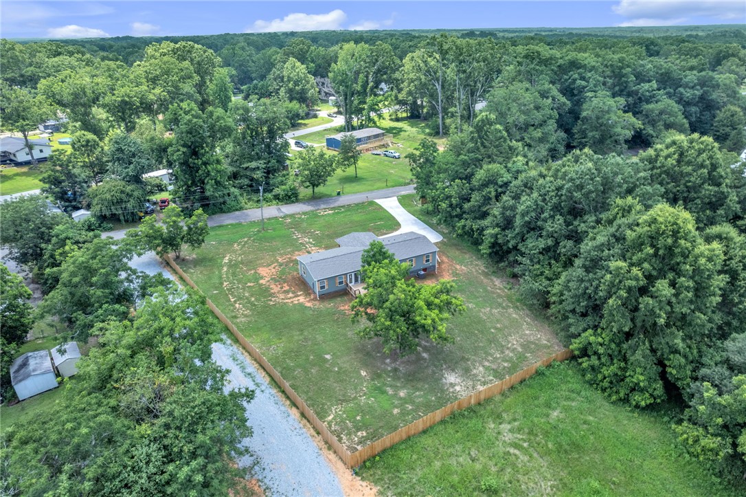 108 Old River Road Iva, SC 29655 - Photo 26 of 31 A private, fenced lot with ample green space surrounds this charming single-family home.