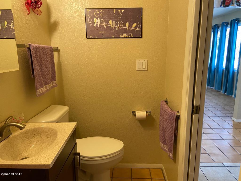 434 Rio Rico Drive Rio Rico, AZ 85648 - Photo 16 of 23 a bathroom with a sink and a toilet