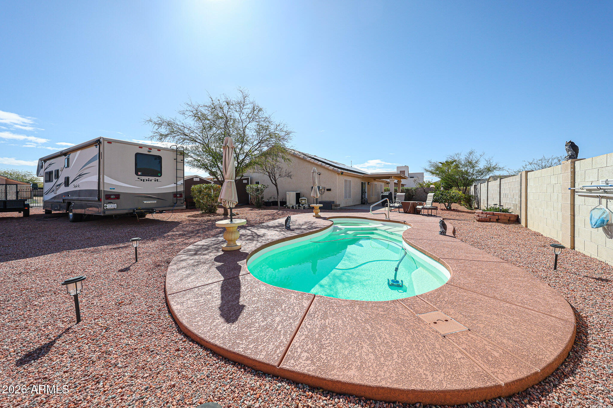 14980 South Capistrano Road Arizona City, AZ 85123 - Photo 27 of 39 a swimming pool with outdoor seating and yard