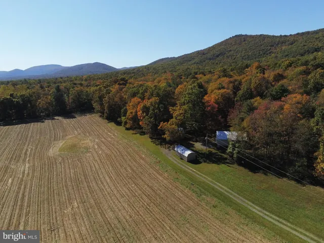 a view of a town with mountains in the background