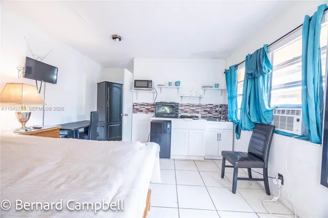 a living room with furniture and a window