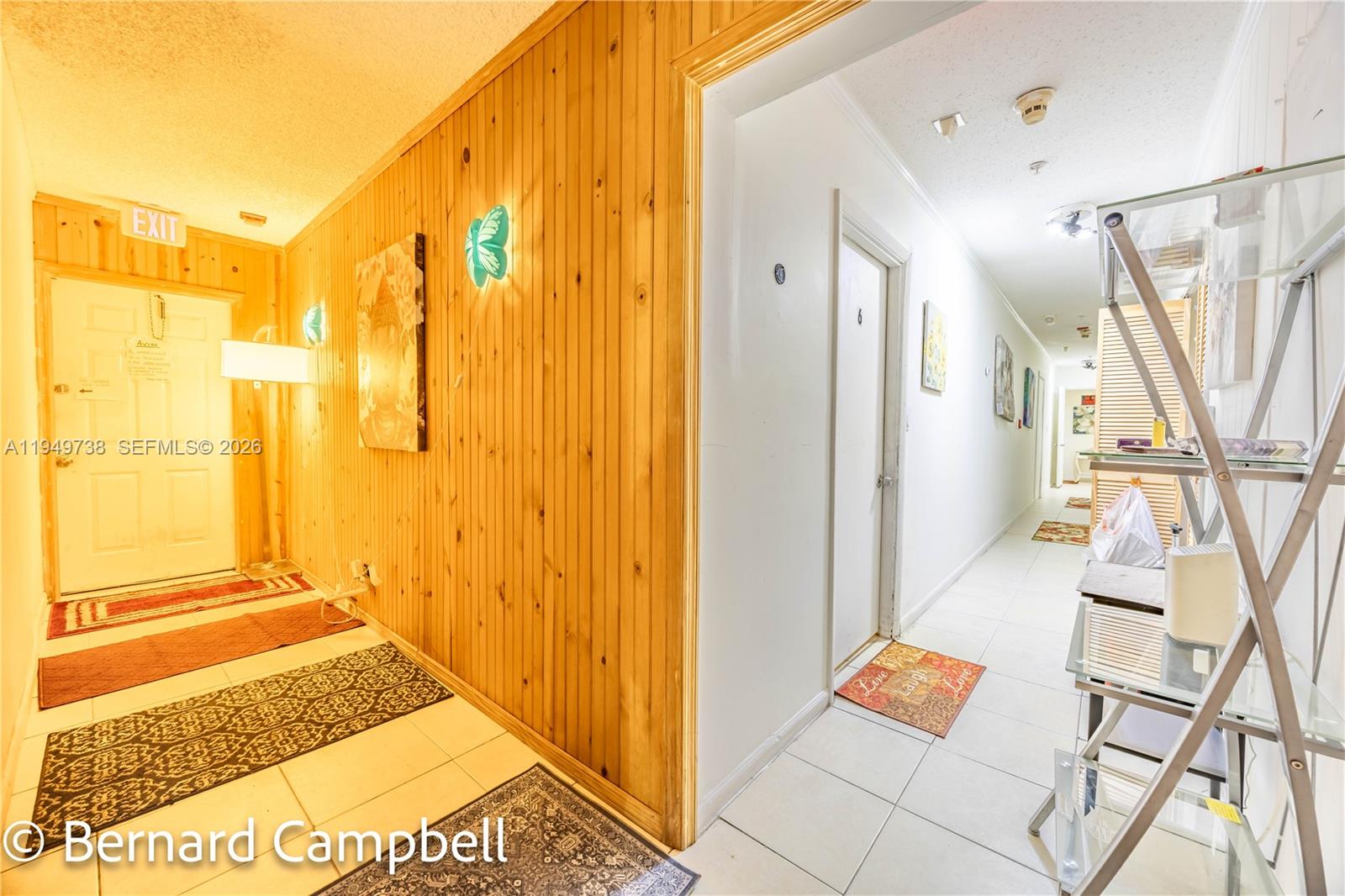 129 Southeast 5th Street, Unit 14 Hallandale Beach, FL 33009 - Photo 7 of 32 a view of an entryway with wooden floor