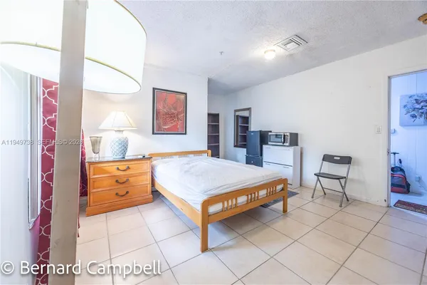 a room with furniture and mirror