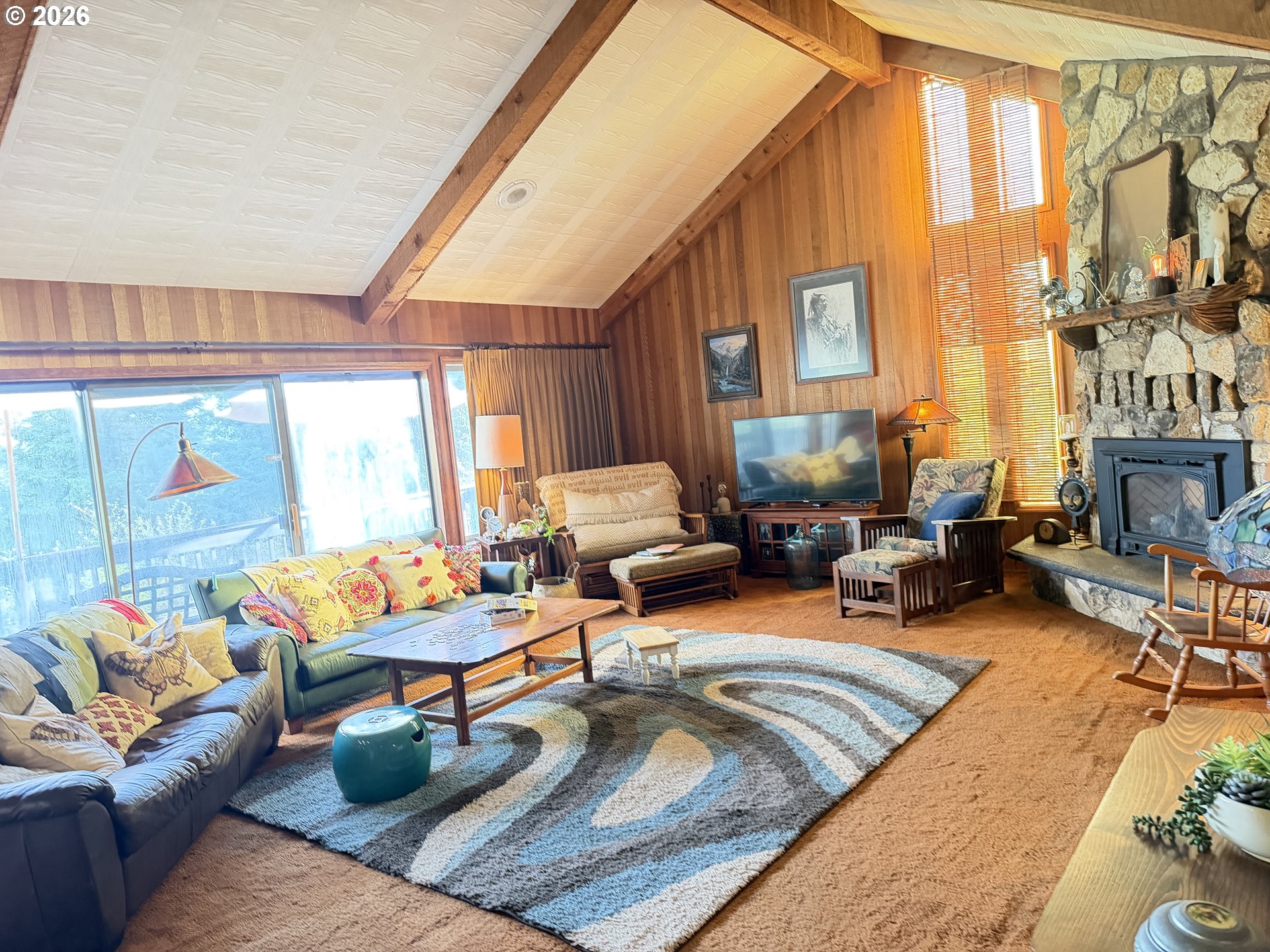 31890 Cater Road Warren, OR 97053 - Photo 30 of 38 a living room with furniture and a large window