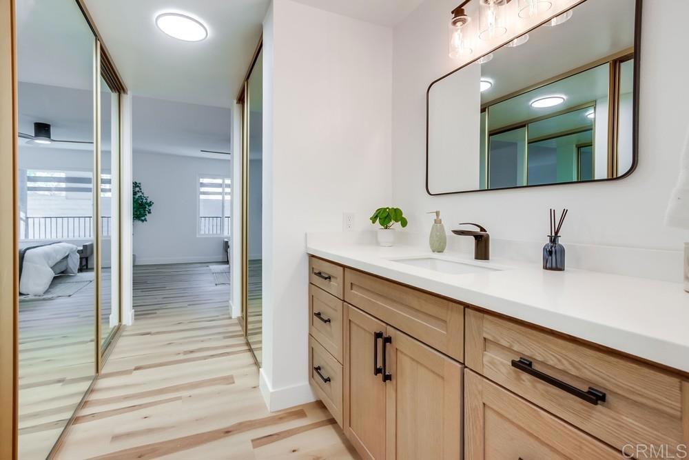 3606 Vista Rey, Unit 37 Oceanside, CA 92057 - Photo 24 of 45 a en suite bathroom with a sink and mirror