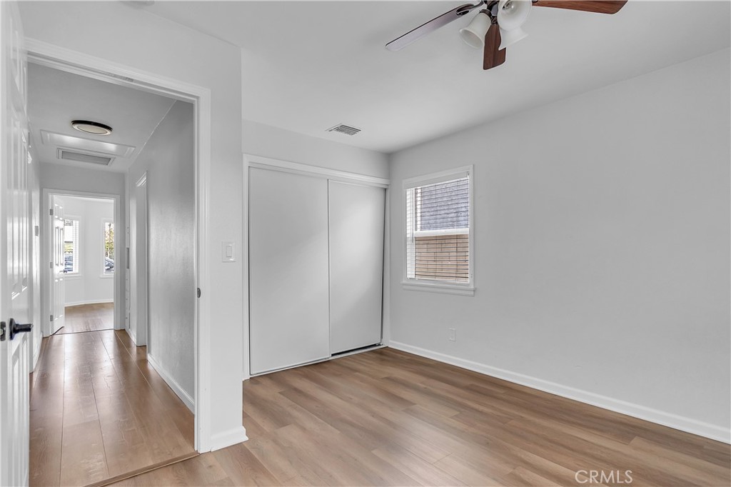 7552 11th Street Buena Park, CA 90621 - Photo 15 of 23 a view of a hallway with wooden floor