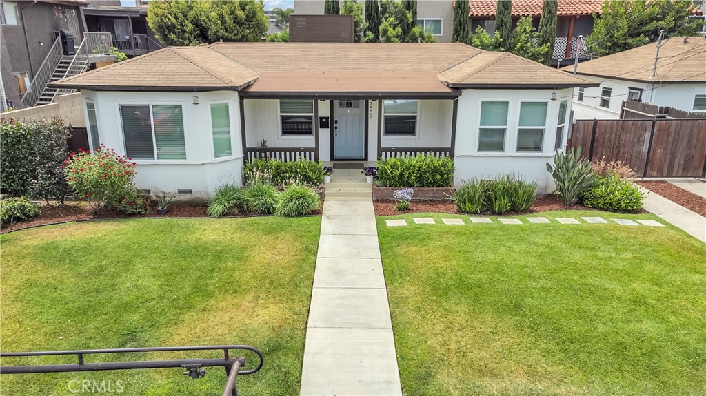 7552 11th Street Buena Park, CA 90621 - Photo 2 of 23 a front view of a house with a yard