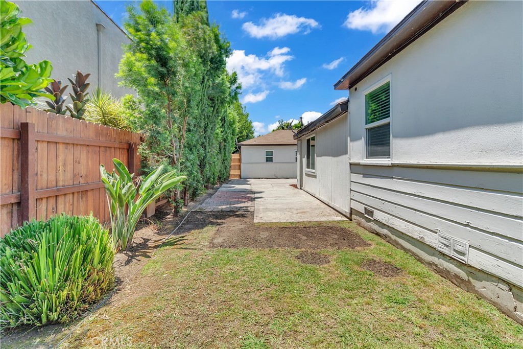 7552 11th Street Buena Park, CA 90621 - Photo 23 of 23 a view of a house with a yard and plants
