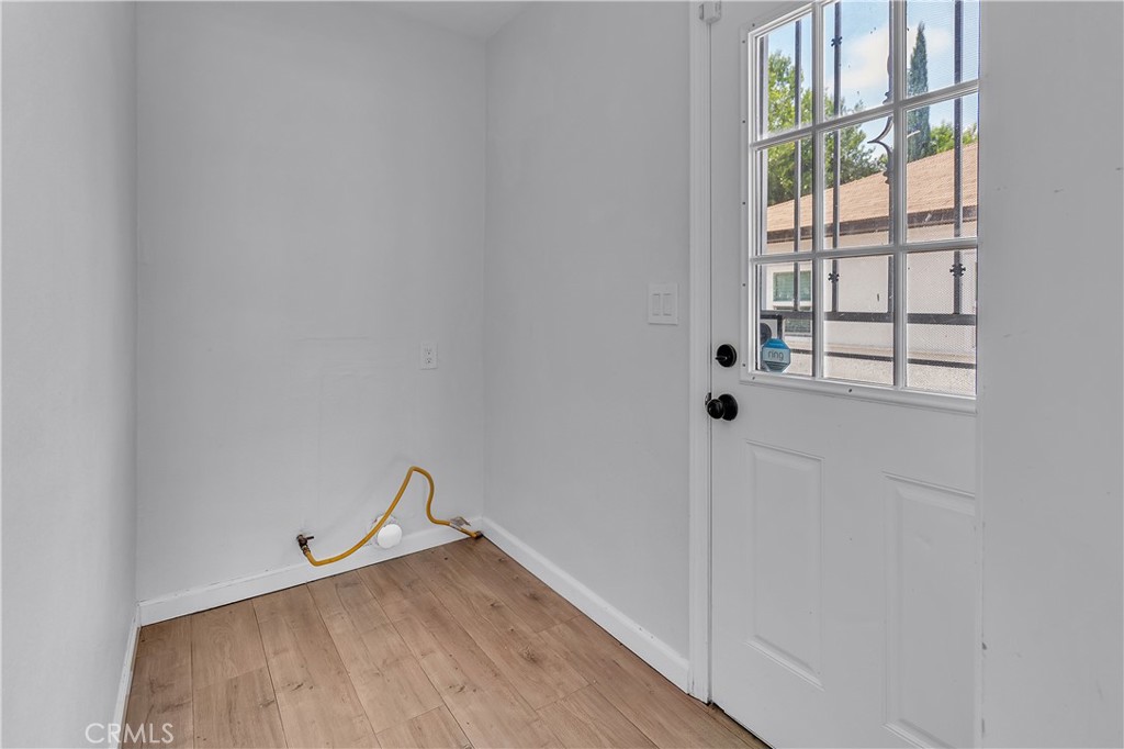 7552 11th Street Buena Park, CA 90621 - Photo 10 of 23 a view of a room with wooden floor and windows