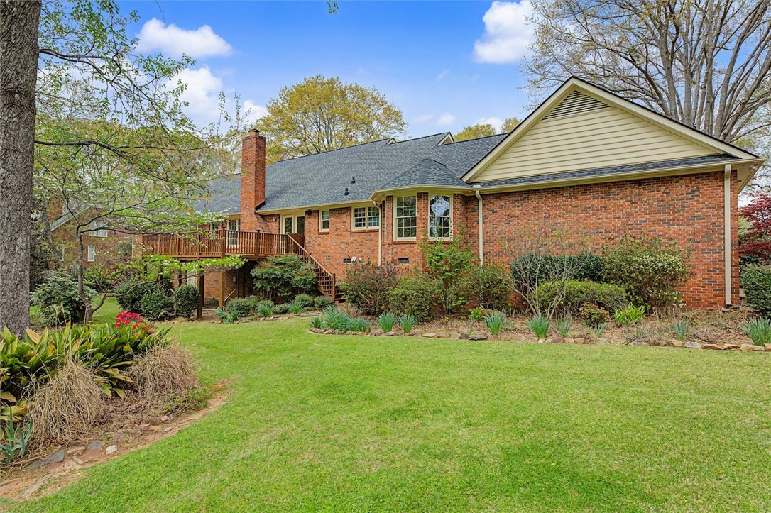 105 Hamilton Drive Anderson, SC 29621 - Photo 11 of 49 This brick residence offers a spacious backyard, elevated deck, and mature landscaping.