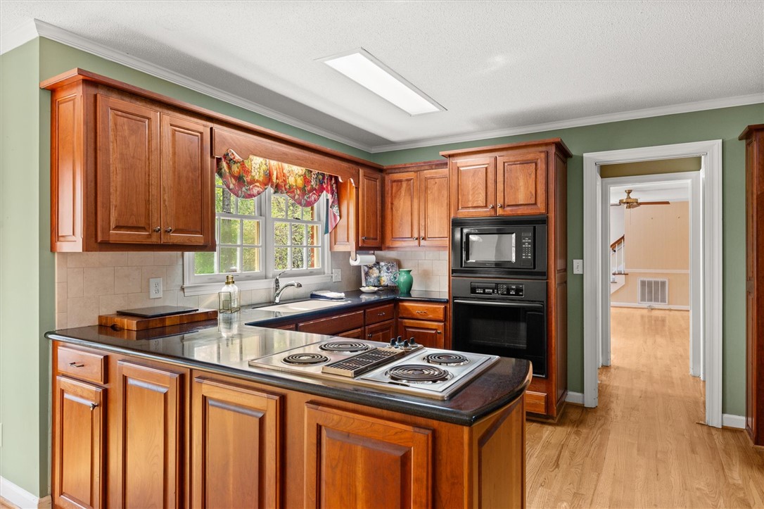 105 Hamilton Drive Anderson, SC 29621 - Photo 20 of 49 This spacious kitchen offers ample cabinet storage and a practical layout for daily living.