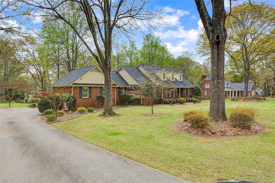 105 Hamilton Drive Anderson, SC 29621 - Photo 2 of 49 This charming residence offers a welcoming facade with traditional architectural details and mature landscaping.