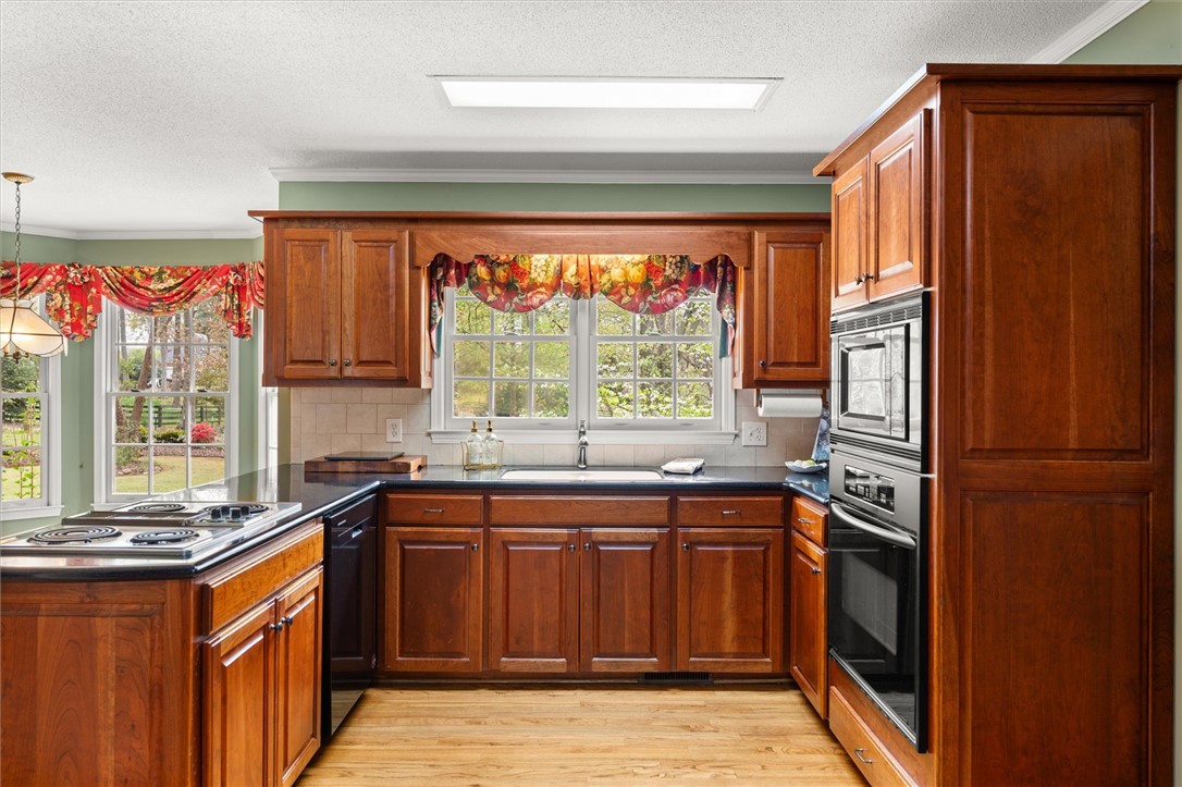 105 Hamilton Drive Anderson, SC 29621 - Photo 21 of 49 This spacious kitchen features ample cabinetry, built-in appliances, and abundant natural light.