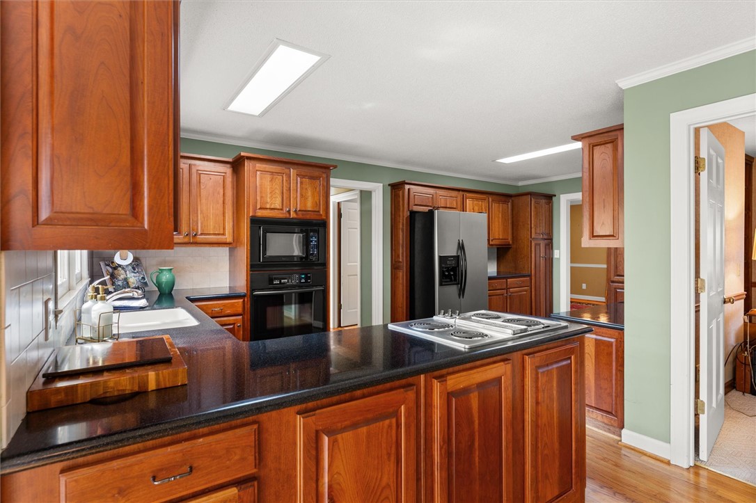105 Hamilton Drive Anderson, SC 29621 - Photo 22 of 49 This spacious kitchen features abundant cabinetry and a central island cooktop, perfect for everyday living.