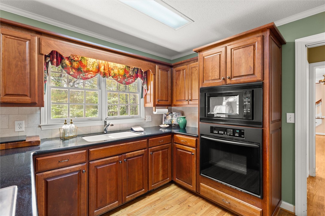 105 Hamilton Drive Anderson, SC 29621 - Photo 25 of 49 This spacious kitchen offers ample cabinetry, modern appliances, and a beautiful view of the outdoors.
