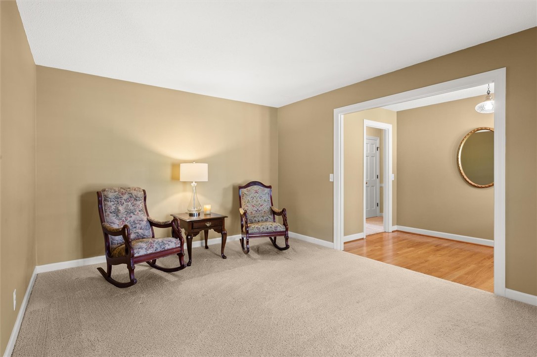 105 Hamilton Drive Anderson, SC 29621 - Photo 28 of 49 This inviting formal living room features soft carpeting and a glimpse of hardwood flooring through an open doorway.