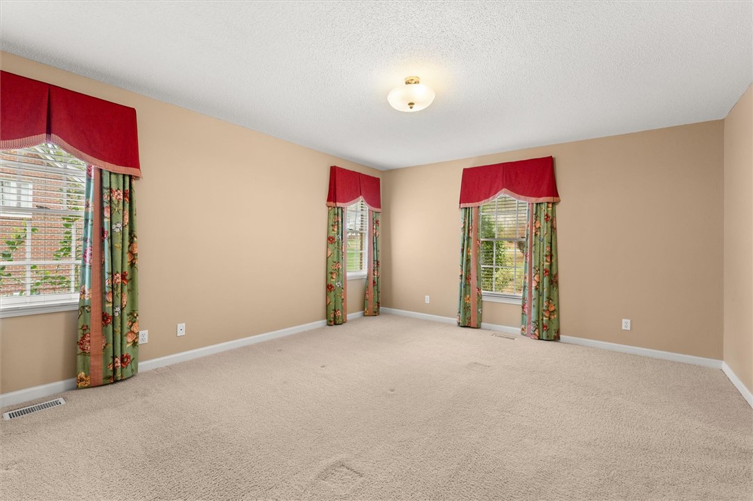 105 Hamilton Drive Anderson, SC 29621 - Photo 33 of 49 This expansive room offers plush carpeting, abundant natural light, and ample space for various arrangements.
