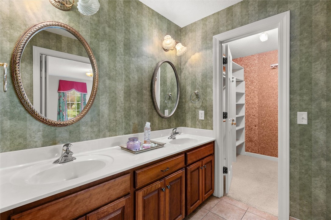 105 Hamilton Drive Anderson, SC 29621 - Photo 36 of 49 This bathroom features a double vanity with ample storage and direct access to a large walk-in closet.