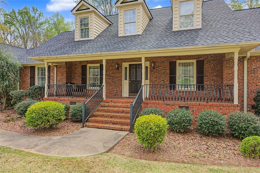 105 Hamilton Drive Anderson, SC 29621 - Photo 4 of 49 This charming brick home features a welcoming porch, lush landscaping, and classic architectural details.