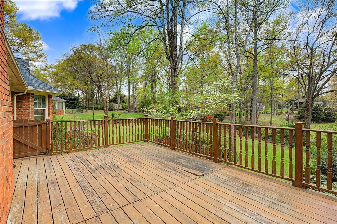 105 Hamilton Drive Anderson, SC 29621 - Photo 49 of 49 This spacious outdoor deck overlooks a verdant landscape, ideal for peaceful enjoyment.