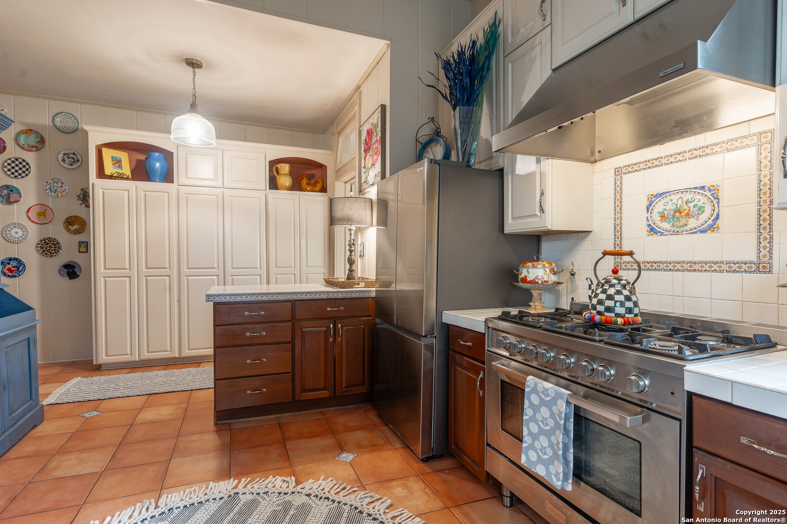 529 North High Street Uvalde, TX 78801 - Photo 16 of 37 a kitchen with stainless steel appliances granite countertop a stove and a sink
