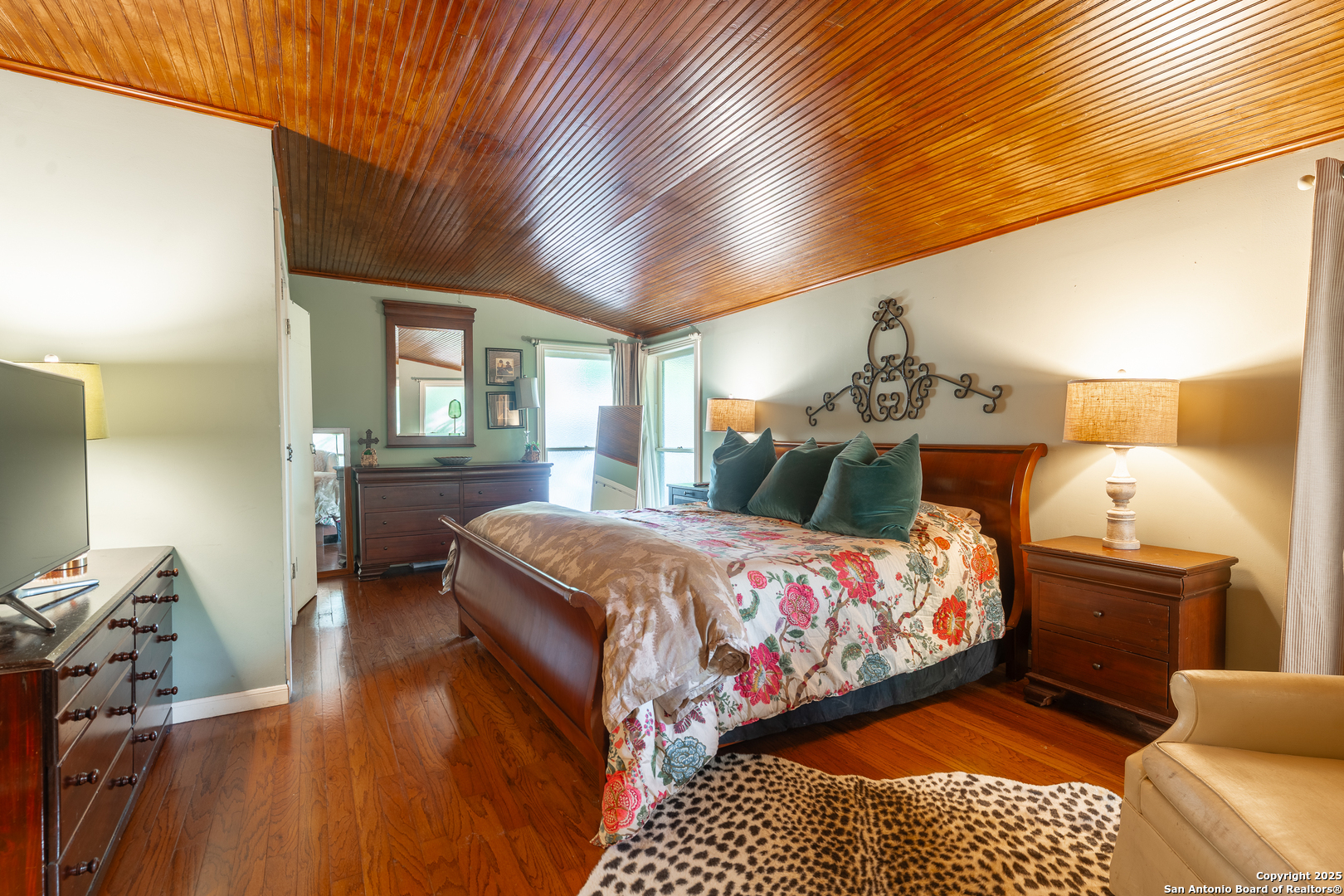 529 North High Street Uvalde, TX 78801 - Photo 18 of 37 a bedroom with a bed and wooden floor