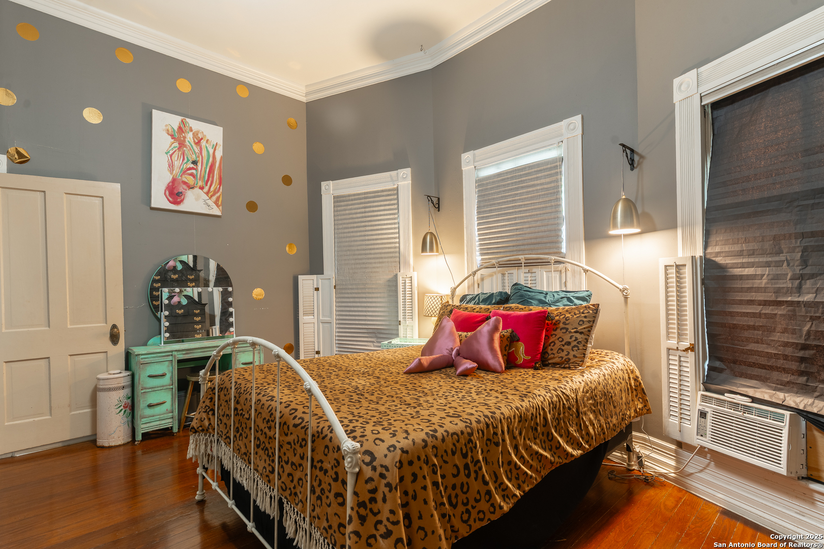 529 North High Street Uvalde, TX 78801 - Photo 22 of 37 a bedroom with a bed and wooden floor